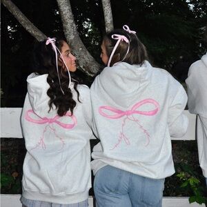 White Hoodie with Pink Bow Design
